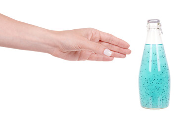 Hand with exotic vegeterian drink with basil seeds. Isolated on white background.