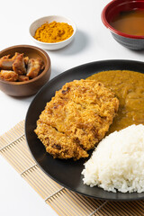 Tonkatsu Curry Rice (Japanese deep-fried pork cutlet with Curry rice) served with karaage (Japanese style fried chicken). on white background. 