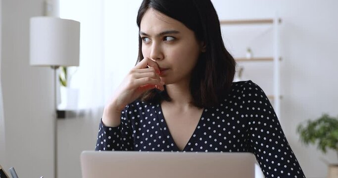 Asian employee woman sit at desk use pc do research, student do assignment writing essay search in internet helpful info busy preparing for exams. Modern tech, challenge search issue solution concept