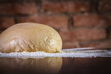 Fresh raw dough for pizza ready to be prepared