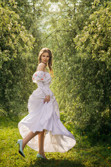 Princess walking in flowering garden