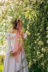 Princess walking in flowering garden