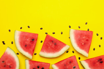 Composition with watermelon slices on yellow background, top view