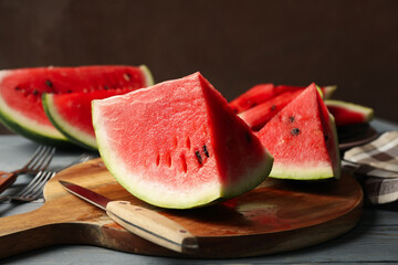 Composition with watermelon slices on gray wooden table. Summer fruit