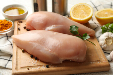 Composition with raw chicken meat on wooden background, close up
