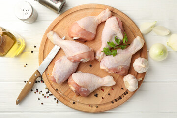 Composition with raw chicken meat on wooden background, top view