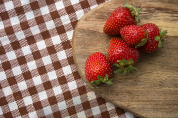 strawberry on checkered fabric