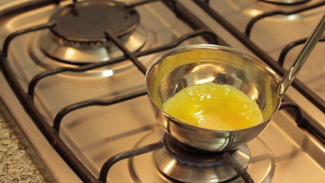 cooking eggs in a ladle and serving a mini omelette