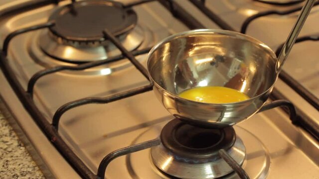 cooking eggs in a ladle and serving a mini omelette