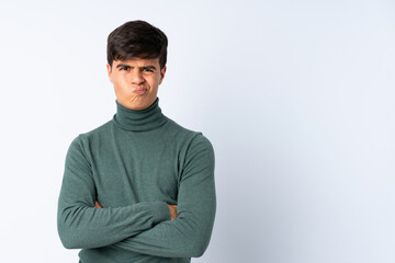 Handsome man over isolated blue background feeling upset