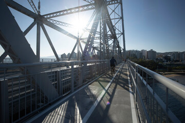 cyclist on the Hercilio Luz bridge, Florianopolis, Santa Catarina, Brazil