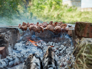 Cooking kebabs on an open fire. Food in nature.
