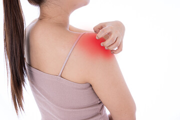 A female scratching her shoulder on isolated white background with red spot. Medical, healthcare for advertising concept.