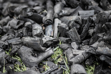 Black charcoal texture background. Close-up. Charcoal is a folk wisdom.