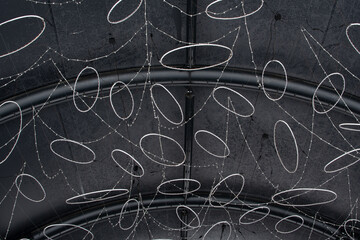 White circles and garlands on a black background
