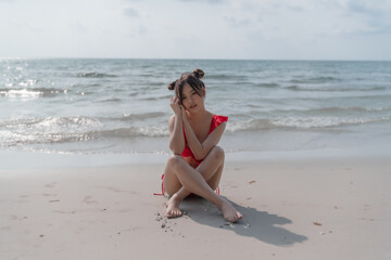 Young sexy woman in bikini enjoying summer vacation on beach relaxing holiday