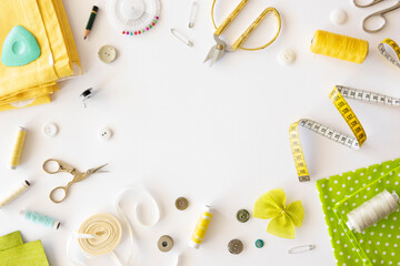 Tailor's workspace and sewing concept border frame. Tool kit for cutting on a white background. Flat lay, copy space