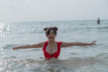 Young sexy woman in bikini enjoying summer vacation on beach relaxing holiday