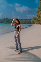 Young sexy woman in bikini enjoying summer vacation on beach relaxing holiday