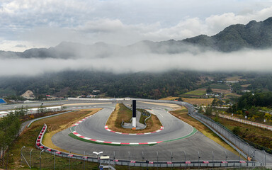 View of racetrack asphalt with curve of motor racing circuit in valley