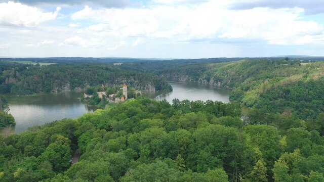 Aerial view on czech medieval castle Zvikov, situated on rocky outcrop above the confluence of two rivers Vltava and Otava, Czech republic