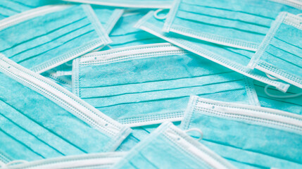 Blue surgical face mask texture background protection against air pollution and COVID-19 coronavirus. Healthcare and medical concept