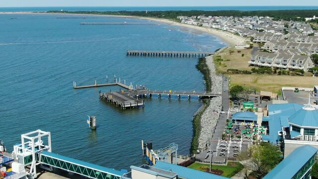 Lewes Delaware ferry passenger terminal and Cape Henlopen State Park, aerial tilt up