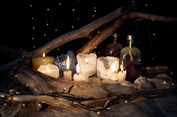 Shelf with candles and bottles in the house of the alchemist