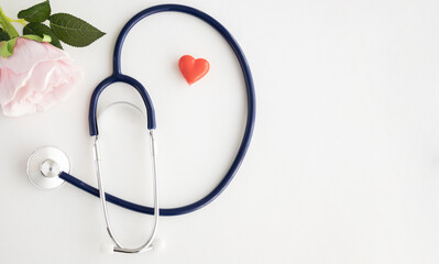 Stethoscope and heart on white background, Close up.