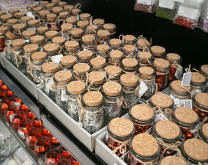 background of cork covers. Decorative jars with cork lids on shelf in store for creativity
