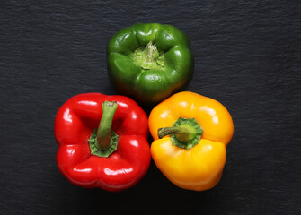 Photography of three bell peppers on slate for food background