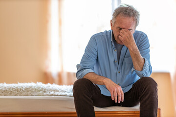 Portrait of senior man looking depressed
