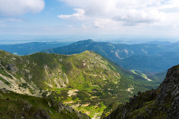 Naklejka na ściany i meble Panoramic photo of summer mountain of Tatra ridge, Slovakia, summer in the mountains. Travel and hike