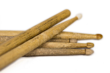 bunch of drum sticks scattered / isolated white background