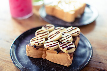chocolate banana bread in ceramic plate on woodden table