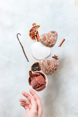 Winter ice cream with gingerbread cookies. Gingerbread cookies and ice cream fall or fly in motion.