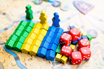 colorful wooden component of board game on game map
