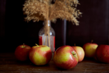 Red apples on a brown table. Close-up.