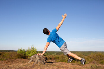 Fototapeta premium Man working out in the countryside