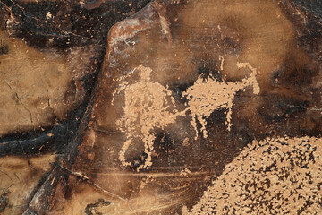 Ancient Native American Indian rock art petroglyph hunter Utah 1483. Nine Mile Canyon, Utah. World’s longest art gallery of ancient native American, Indian rock art, hieroglyphs, pictographs.