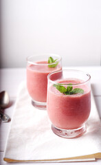Cold strawberry soup with mint in glasses