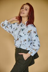 young business women on yellow background in green coctume