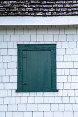 green window on textured wall