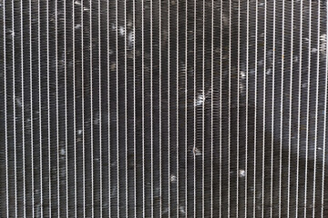 close up the damage of car cooling radiator. The old radiator of the damaged car. 