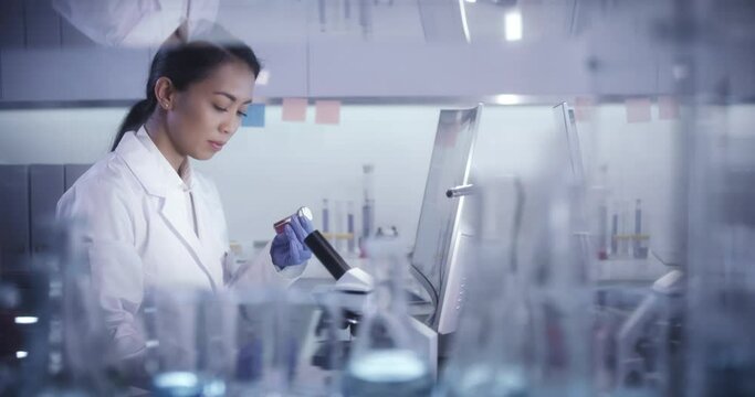 Female doctor working in laboratory. Studying medical samples