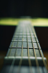 Close up of acoustic guitar with metal strings. Music concept