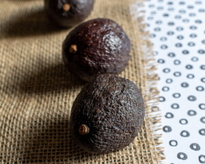avocados on burlap background 