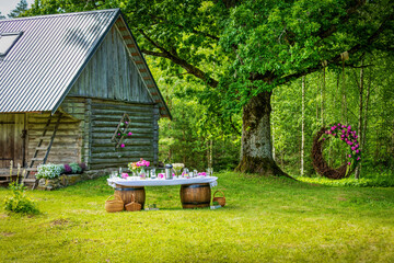 beautiful wedding banquet buffet table and decoarations in rustic style in the country garden