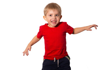 Happy little boy in red t-shirt jumping on white isolated background