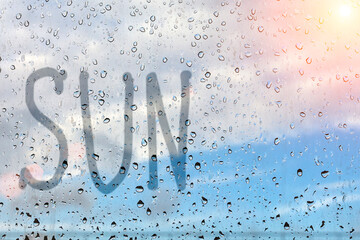 rain, the inscription on the sweaty glass - inscription sun